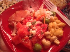 Awesome platter: prosciutto,coleslaw,mac'n cheese, marinade mushroom,green olives, water melon salad. 